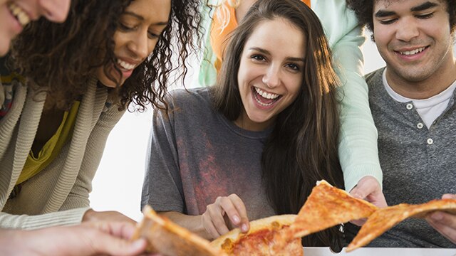 Friends eating a pizza