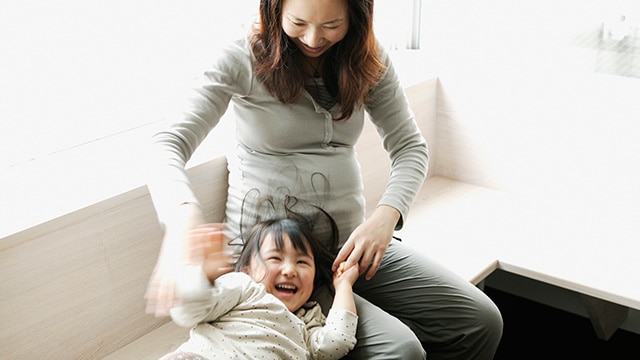 Mother playing with her daughter