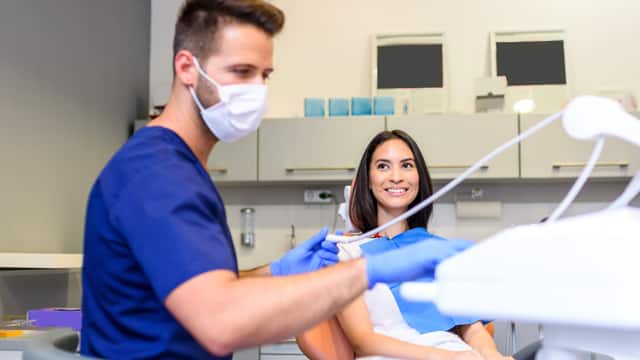 dentist and patient talking dentist and patient talking