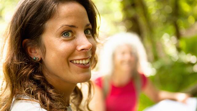 Side view of woman with wide smile